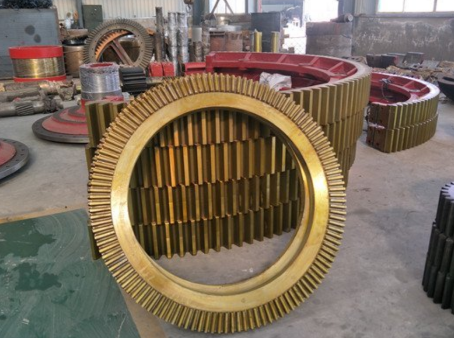 Bi‑part split girth gear showing inner joint flange for cement ball mill, anti‑rust coated cast steel big gear ring Bi‑part split girth gear showing inner joint flange for cement ball mill, anti‑rust coated cast steel big gear ring